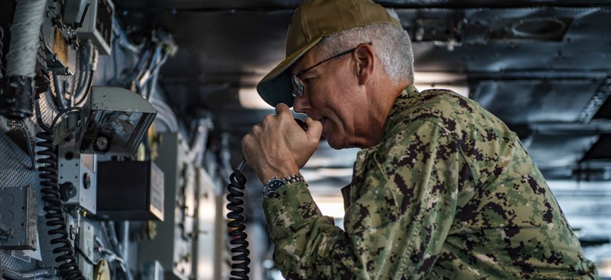 Vice Adm. Karl Thomas addresses the crew of Nimitz-class aircraft carrier USS Carl Vinson during a visit in 2021.